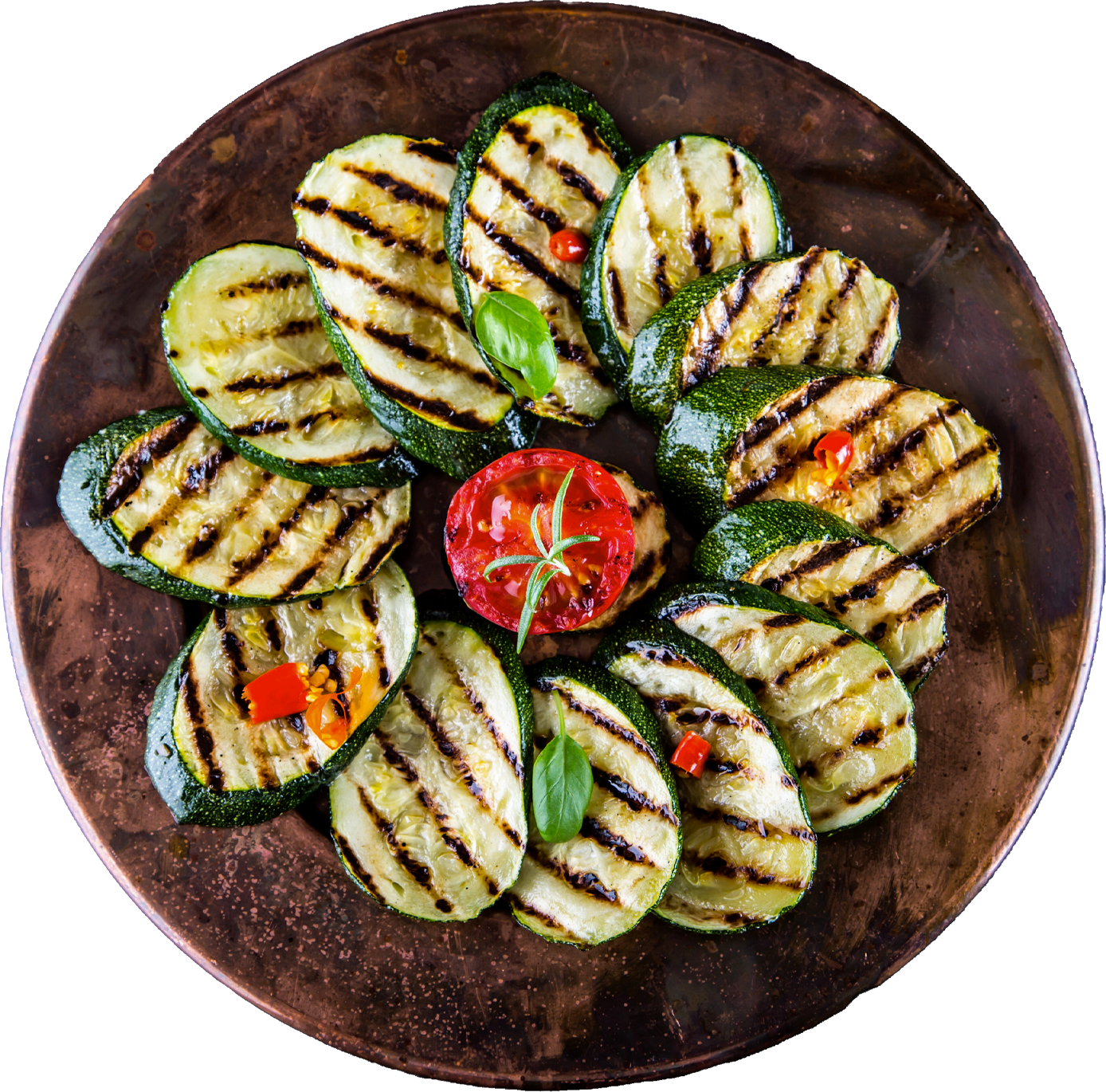 Gegrillte Zucchini auf einem Teller angerichtet.