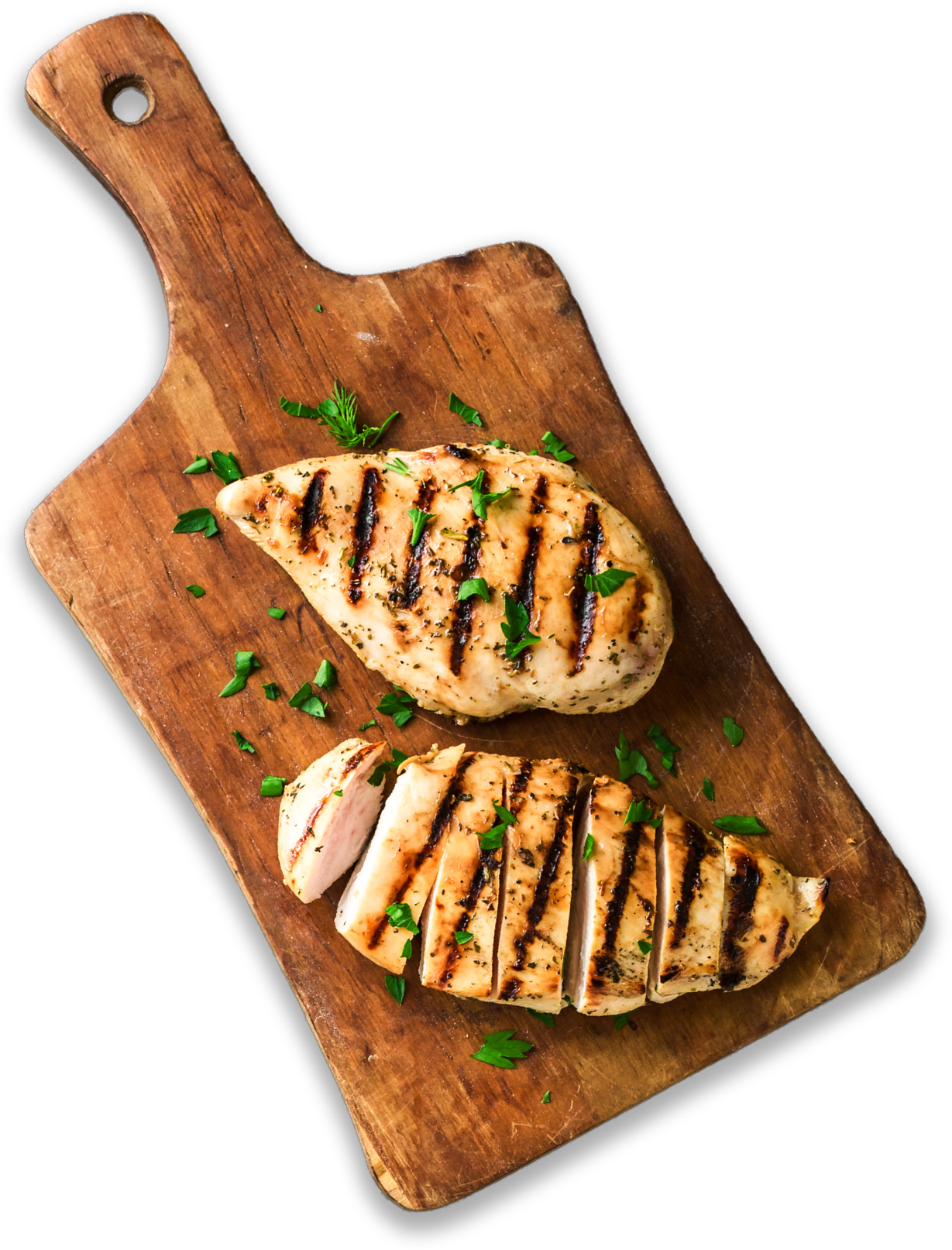 Gegrilltes Hähnchen schön angerichtet auf einem Holzbrett.